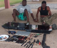The arrested suspects with the retrieved items by the police