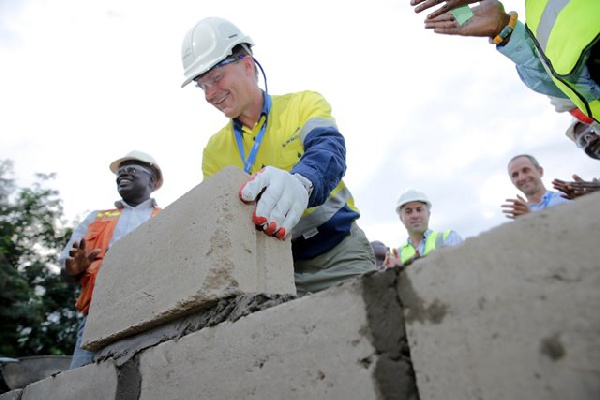 Gary Goldberg CEO of Newmont Mining Corporation, laying block for commencement of the firestation