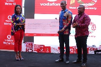 Winner of the Vodafone Anniversary Logo Competition [C] receiving his prize