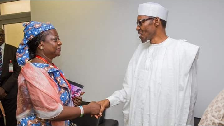 A former senior goment official Lauretta Onochie with former presido Buhari