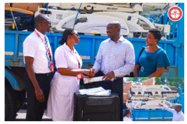 Dr Asare-Bawuah (2nd Right) presenting the items to Gifty Nkum