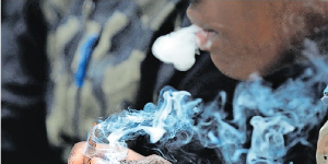 A man smokes marijuana during the informal cannabis holiday on April 20, 2017