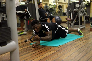 Sulley Muntari works out in the gym on pre-season
