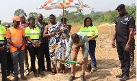An Ashantigold official undertaking the sodcutting ceremony