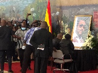 Former President, John Dramani Mahama and his wife Lordina Mahama signing the book of condolence