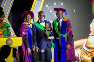 Andrew Kwabena Asamoah in a photo with dignitaries