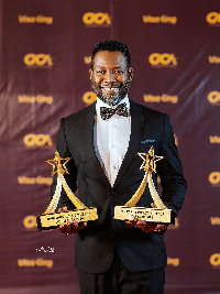 Actor Adjetey Anang receives awards at the Ghana Celebrity Impact Awards