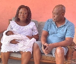 Daniel Naawu and his wife Audrey Agyapong with one of the twins