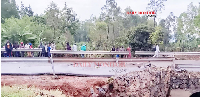 Locals gather at Nalugugu Bridge which was washed away by floods in Sironko District