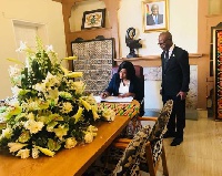 Ms. Babara O.Neresa, Ugandan High Commissioner to South Africa, signing the book of condolence