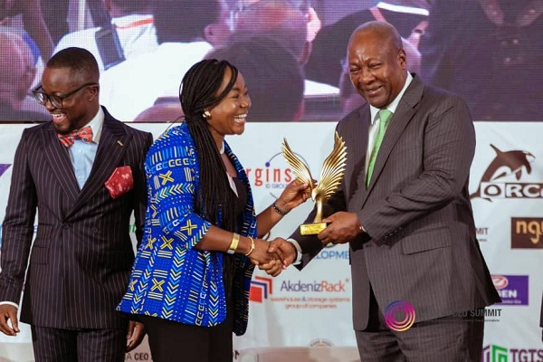 Grace Arthur receiving her honour from President John Dramani Mahama