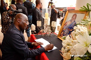 Vice President, Dr. Mahamudu Bawumia signing Appiah Menka's book of condolence