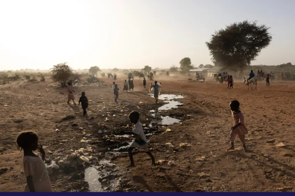 Sudanese children play by the Sudanese border in an Adre, Chad, transit camp