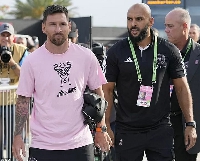 Lionel Messi (left) with Yassine Chueko