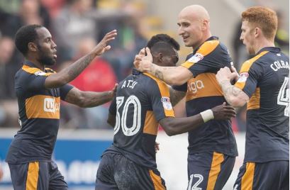 Newcastle United's Atsu is congratulated by Jonjo Shelvey after scoring his side's first game