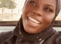 A nurse at the Kpalgun CHPS Compound celebrates her new free primary healthcare tricycle