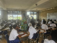 A picture of student seated for BECE