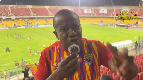A photo of a happy Hearts of Oak supporter at the Accra Sports Stadium