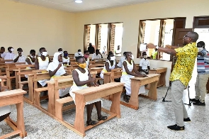 A Teacher Interacting With Students During The Commissioning Of Newly Constructed 3 Unit Classroom B
