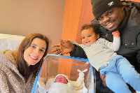 Freezy with his family, including the newborn
