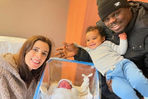Freezy with his family, including the newborn