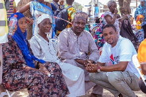 Senyo Tsagli interacting with some of the beneficiaries