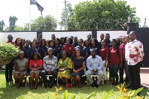 Management of Origin8 in a group picture with the Central University students