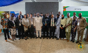 The minister (middle in white) in a group picture with foreign invited experts and some participants
