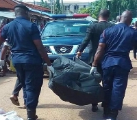 File photo of police carrying a corpse
