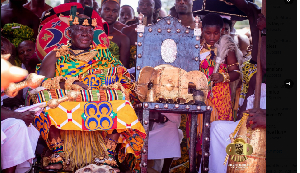 Otumfuo Osei Tutu II sits in state with the Golden Stool