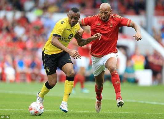 Jordan Ayew battles Kevin Wilson for the ball