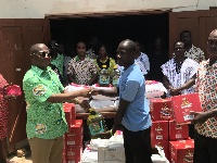 The NLA Driector General presenting the items to an institution.