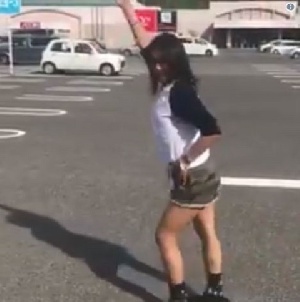 A japanese lady doing the 'Akwaaba' dance in style
