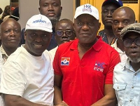 Henry Kokofu (in red shirt) shakes hands with Odeneho Kwaku Appiah aka COKA (L)