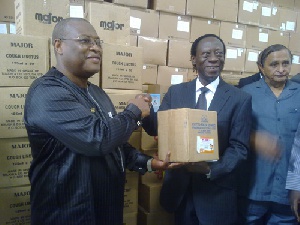 James Ohemeng-Kyei (2nd right) handing over the drugs to Alex Segbefia