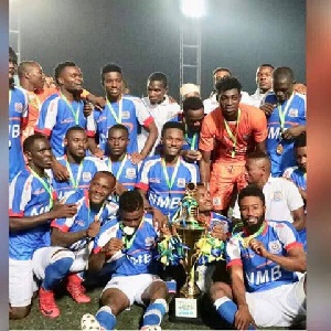 Azam FC players celebrate after winning the trophy