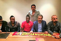 Asamoah Gyan with Kayserispor head coach Marius Samudica  and other officials