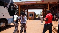 Passengers arriving in Kenya from Uganda at the Busia border