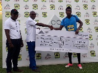Felix Annan(R) receiving his cheque for winning March Player of the Month