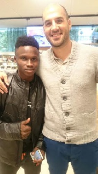 Evans with his agent at HJK Helsinki after passing the medical on Monday