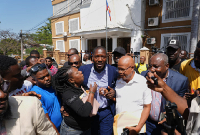ormer congressman Abel Decollines leaves the premises after registering his political party