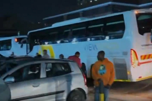 Some of the evacuees ready to board the buses