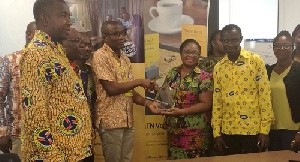 Pala Ofori Asiedu and MTN Finance Team receiving the award from ECG Accra East