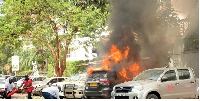Police fire brigade, Redcross and volunteers put out fire after a bomb explosion in Kampala
