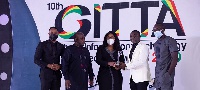 AirtelTigo officials receiving the award from the CEO of Instinct Wave