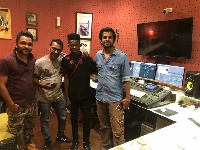 Strongman with others in the studio