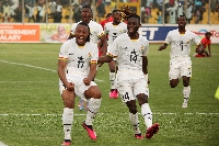 Some Black Stars playing celebrating after their victory