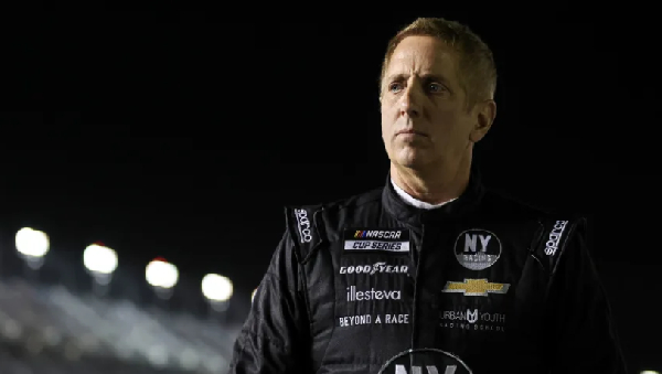 Greg Biffle walks on pit lane during qualifying for a NASCAR Cup Series race in 2022