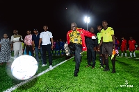 Asenso-Boakye kicks a ball to inaugurate the turf