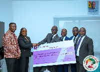 Representatives of the fund receiving the donation from the bank